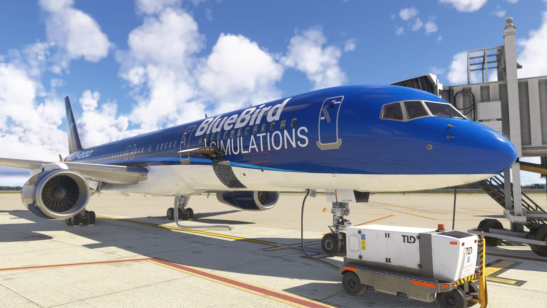 Boeing 757 in BlueBird Simulations livery parked at a gate beside ground equipment